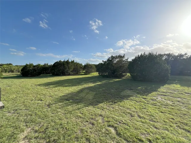 a view of a big yard next to a house