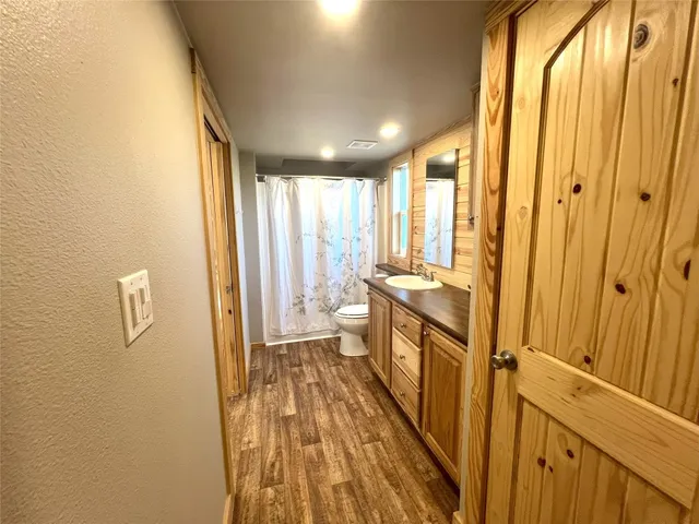 a view of a bathroom with a sink and a mirror