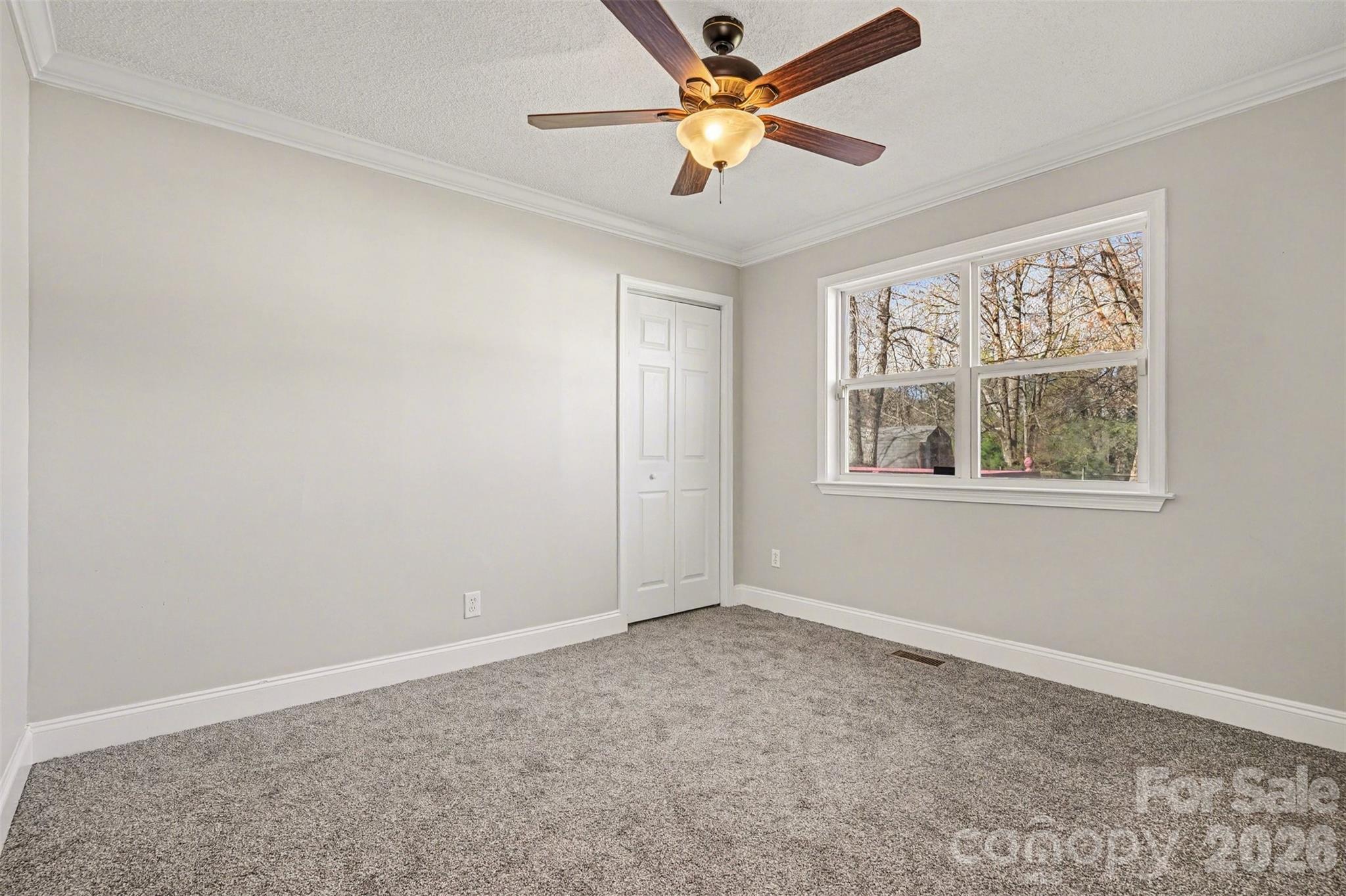 1050 Legion Club Road Salisbury, NC 28146 - Photo 21 of 29 an empty room with windows and fan