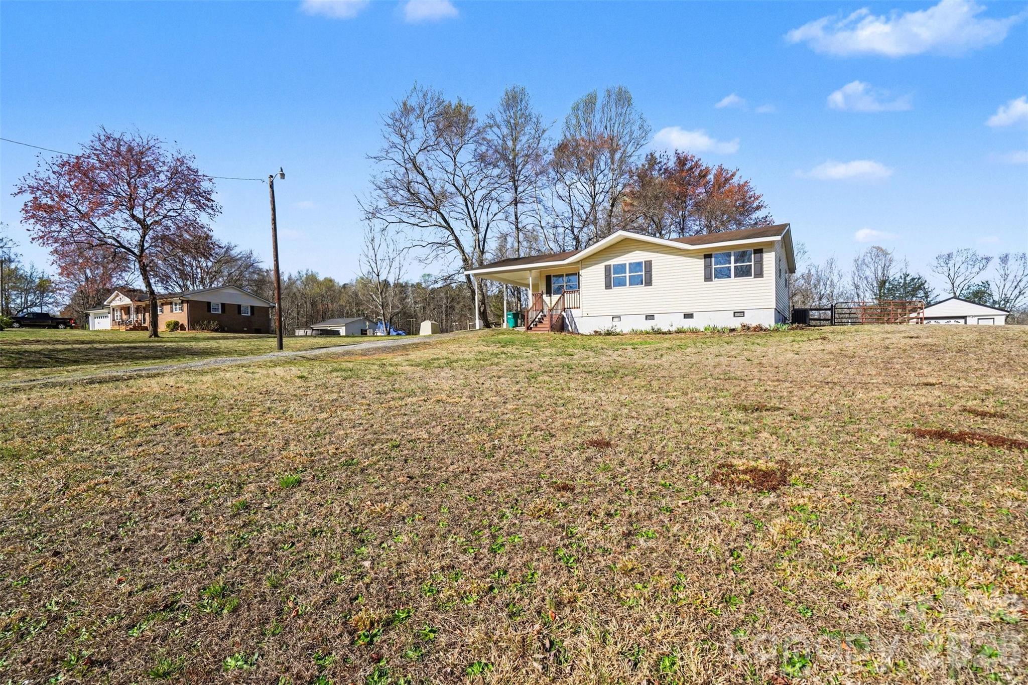 1050 Legion Club Road Salisbury, NC 28146 - Photo 28 of 29 a big house with a big yard and large trees