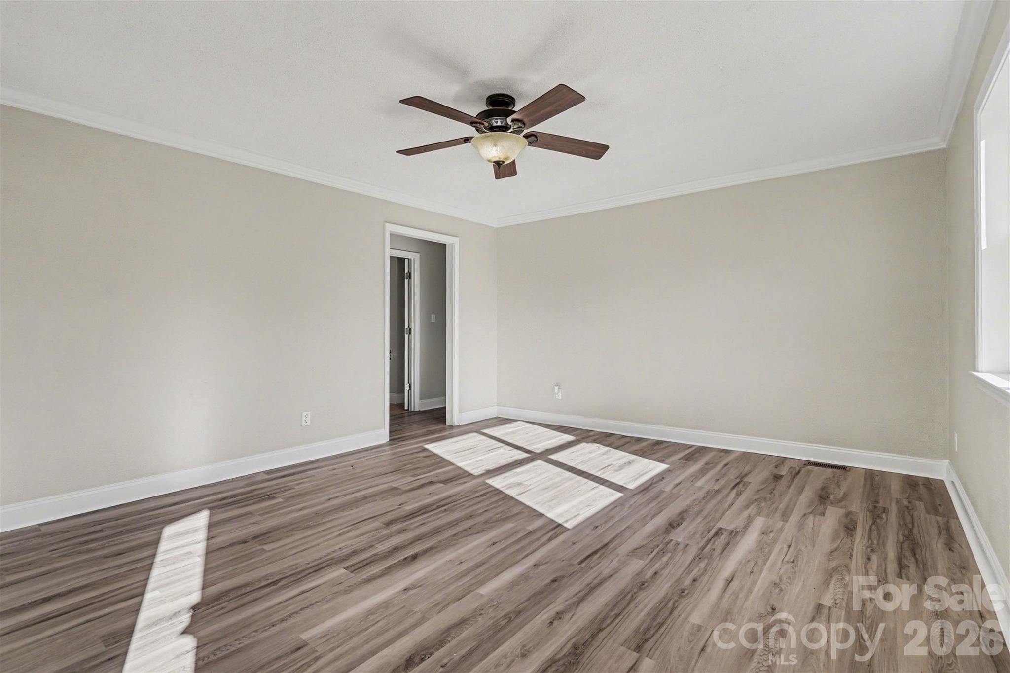 1050 Legion Club Road Salisbury, NC 28146 - Photo 6 of 29 wooden floor in an empty room with a window