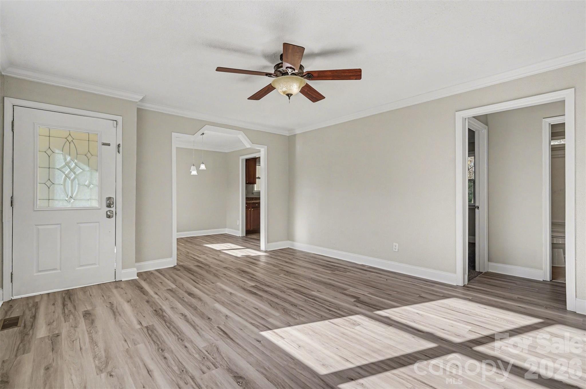 1050 Legion Club Road Salisbury, NC 28146 - Photo 7 of 29 a view of a room with wooden floor and ceiling fan