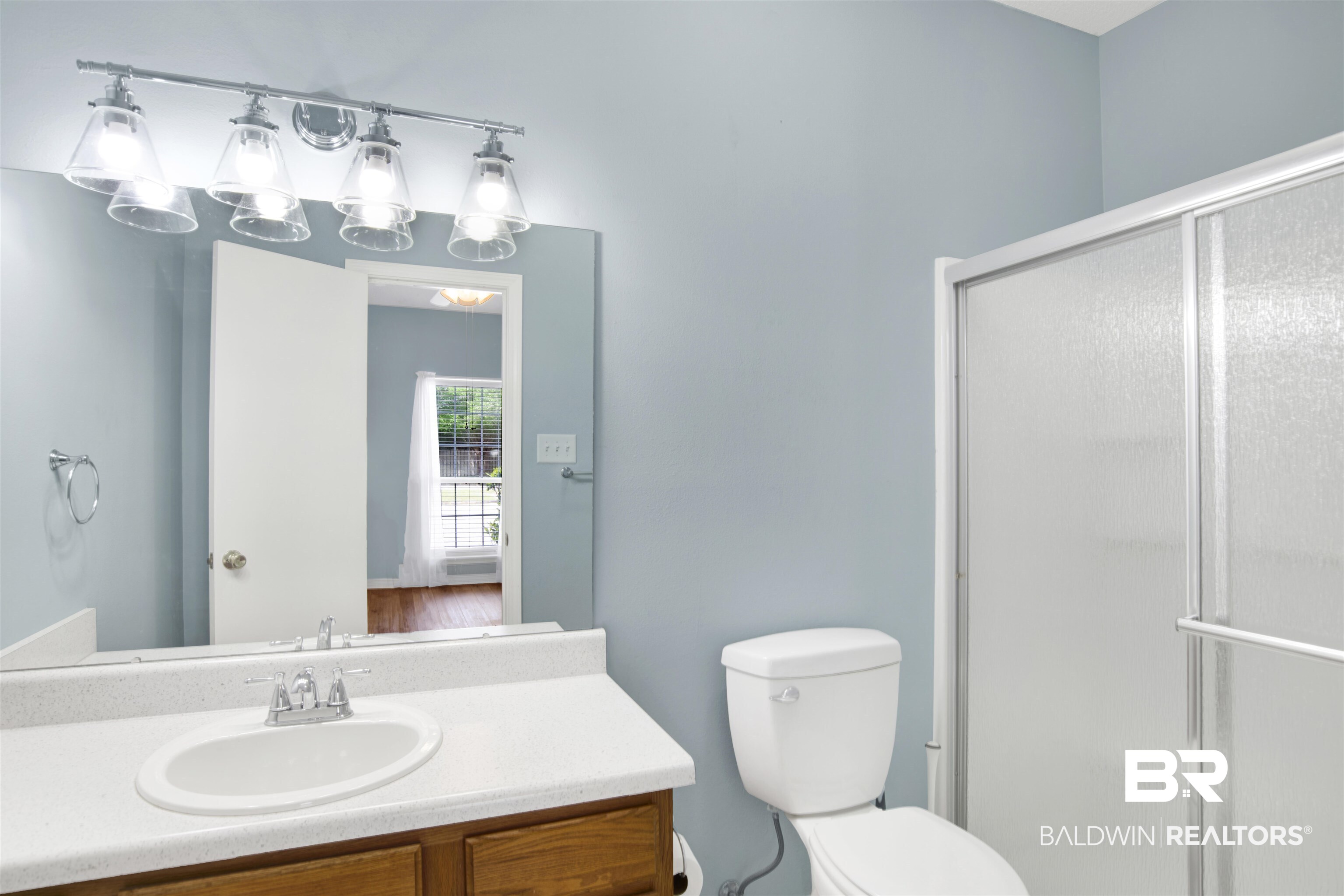 1258 Sutton Court, Unit 4 Mobile, AL 36609 - Photo 12 of 19 Bathroom with toilet, a shower stall, and vanity