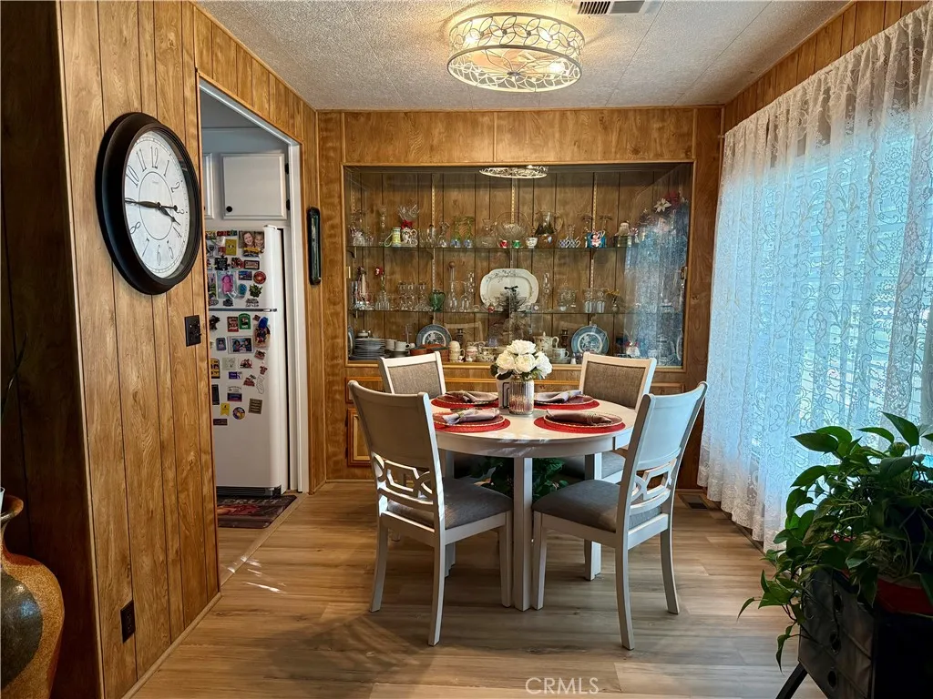 15181 Van Buren Riverside, CA 92504 - Photo 12 of 26 a dining room with furniture a chandelier and a window