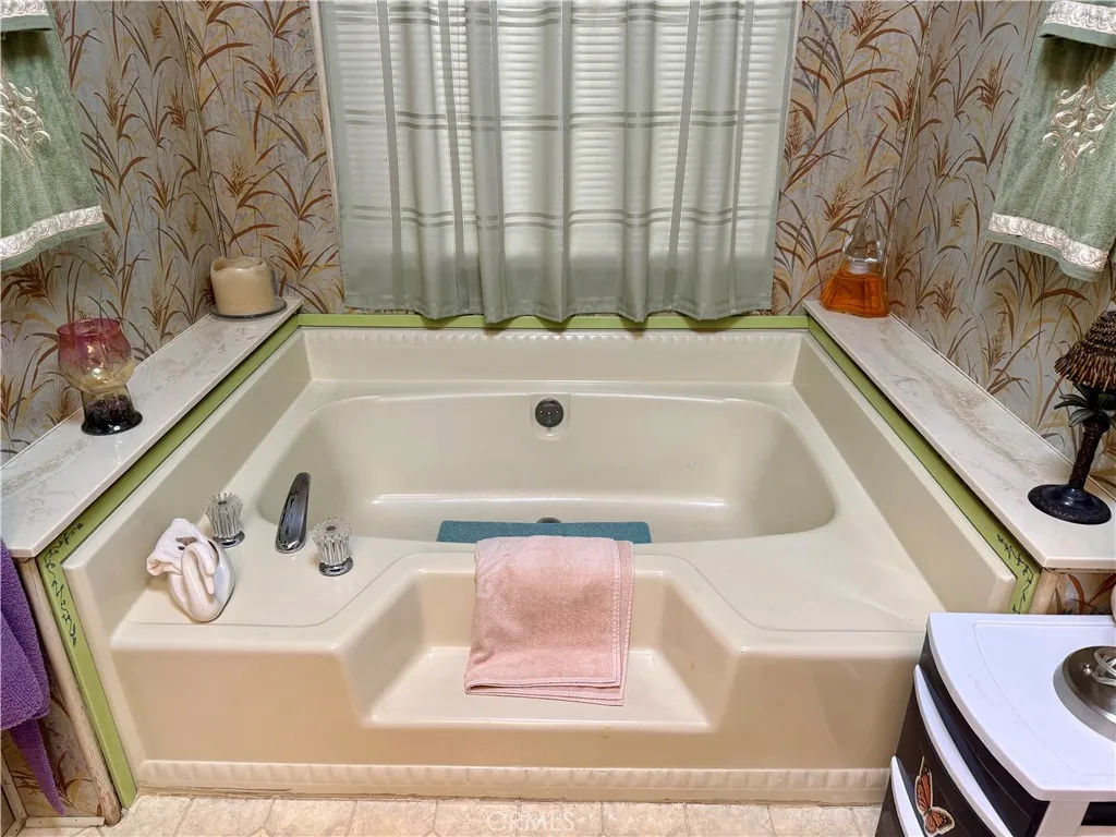 15181 Van Buren Riverside, CA 92504 - Photo 15 of 26 a bathroom with a bathtub and shower