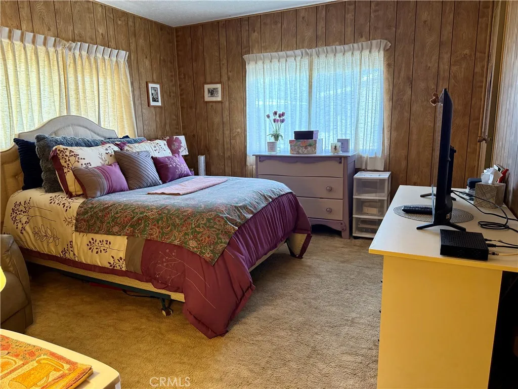 15181 Van Buren Riverside, CA 92504 - Photo 17 of 26 a bedroom with a bed and a dresser