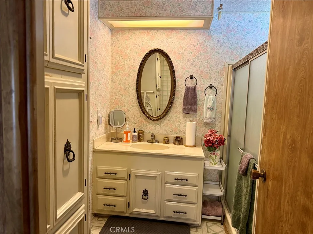 15181 Van Buren Riverside, CA 92504 - Photo 18 of 26 a bathroom with a sink and a mirror