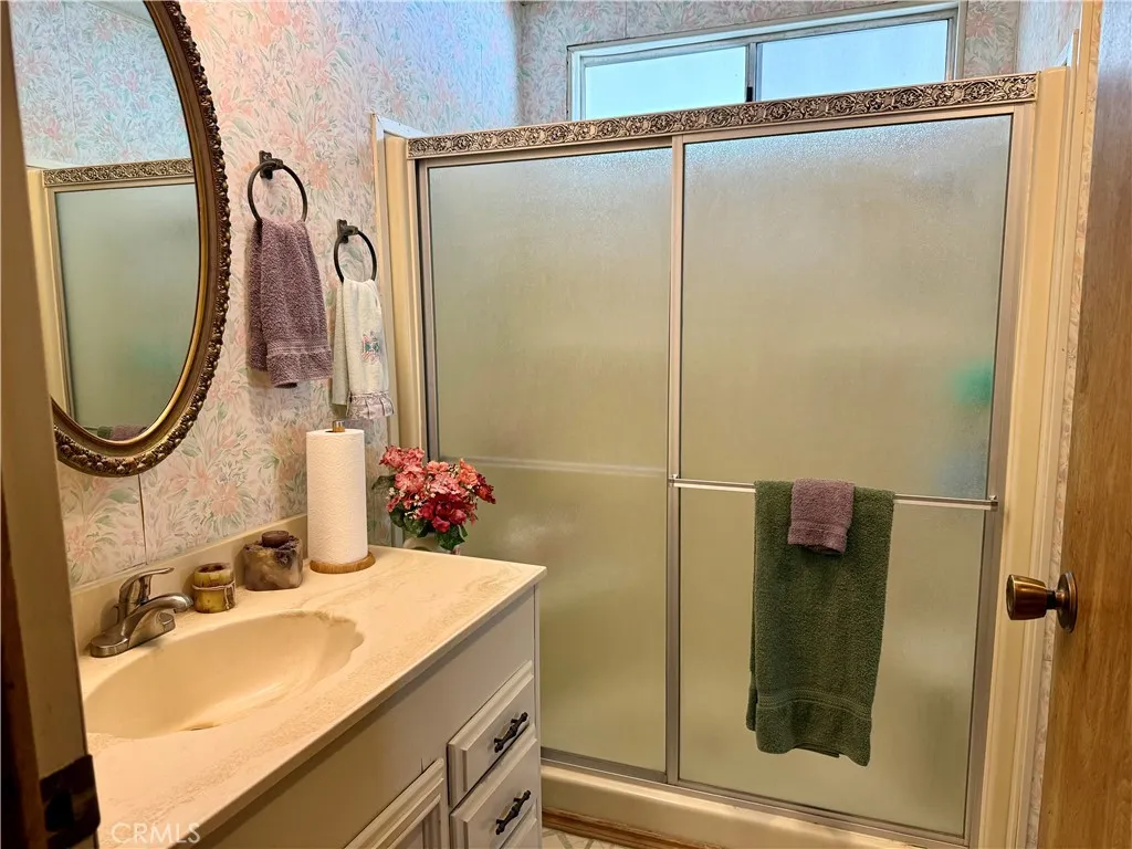 15181 Van Buren Riverside, CA 92504 - Photo 19 of 26 a bathroom with a sink and a mirror