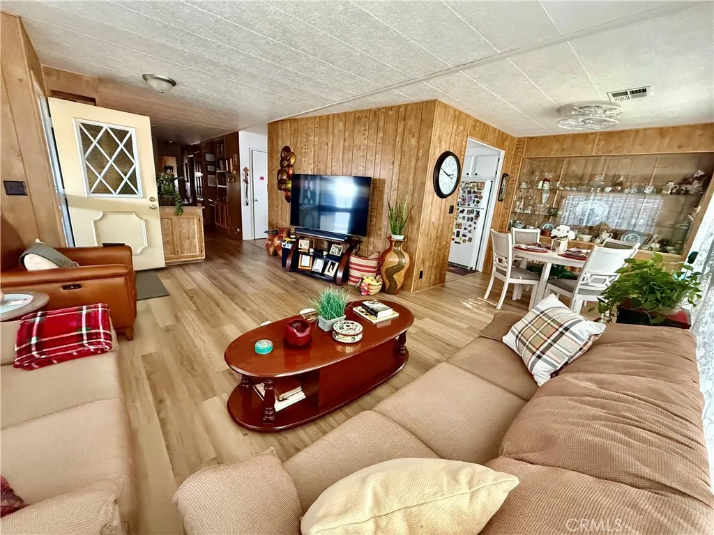 15181 Van Buren Riverside, CA 92504 - Photo 4 of 26 a living room with furniture and a flat screen tv