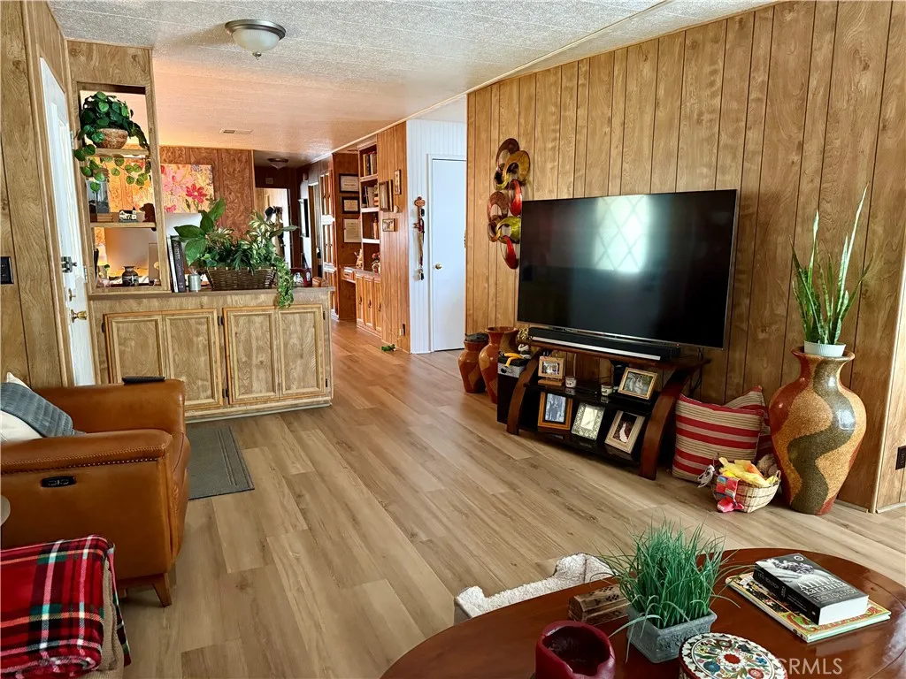 15181 Van Buren Riverside, CA 92504 - Photo 5 of 26 a living room with furniture and a flat screen tv