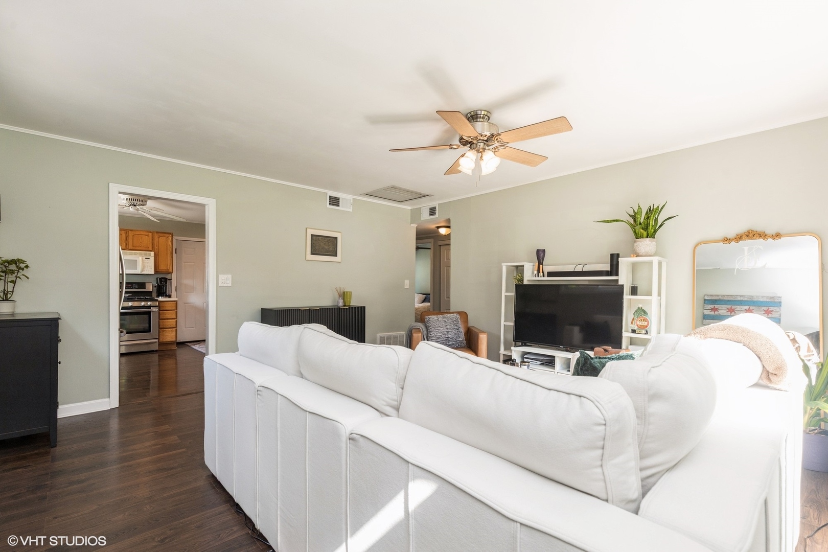 24 Johnathan Road Lake Zurich, IL 60047 - Photo 2 of 12 a living room with furniture and a flat screen tv