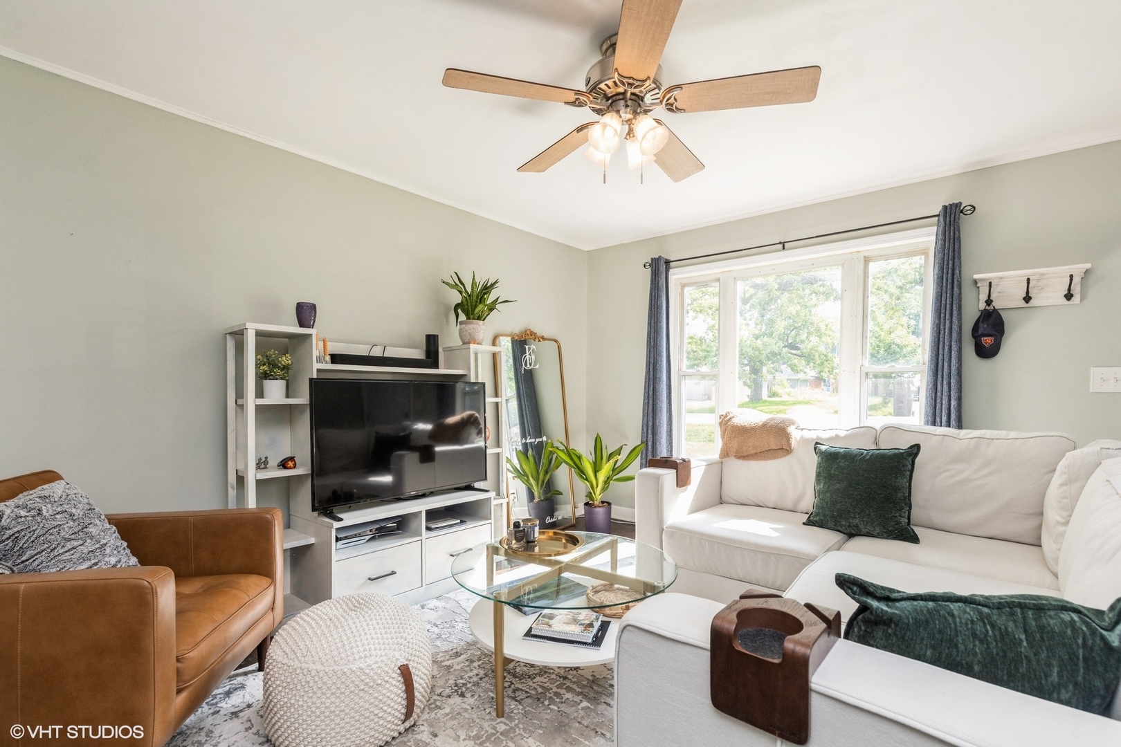 24 Johnathan Road Lake Zurich, IL 60047 - Photo 3 of 12 a living room with furniture a flat screen tv and a large window