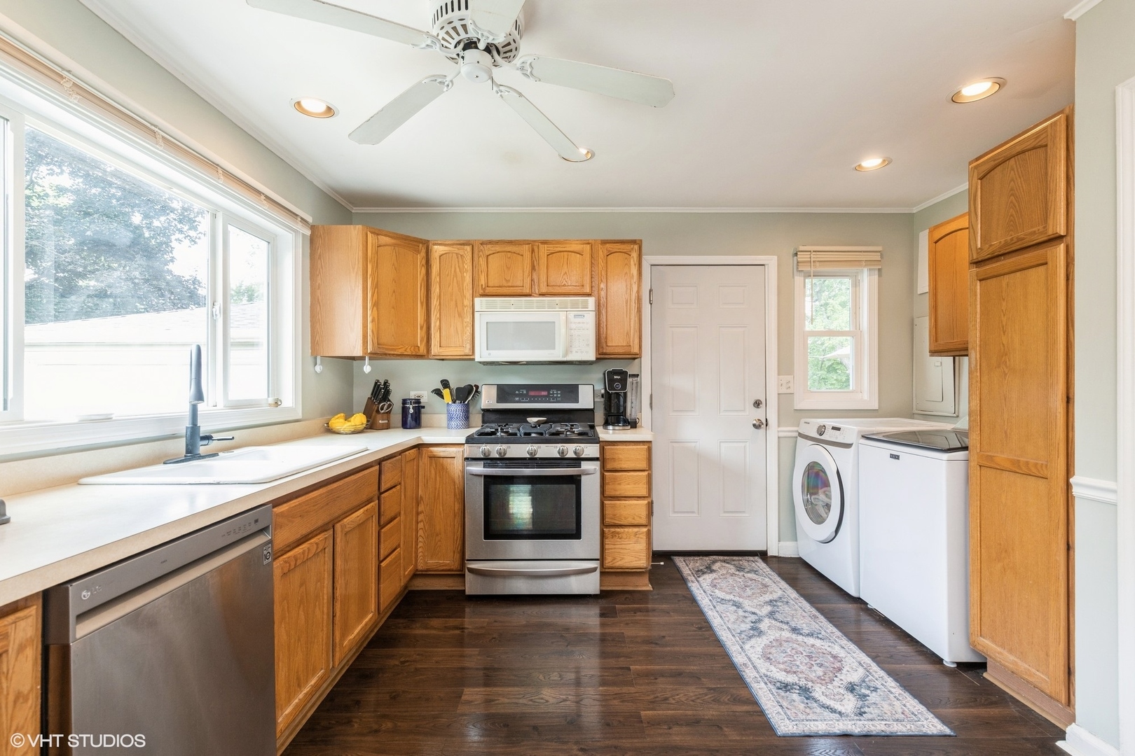 24 Johnathan Road Lake Zurich, IL 60047 - Photo 6 of 12 a kitchen with a stove a sink and a window