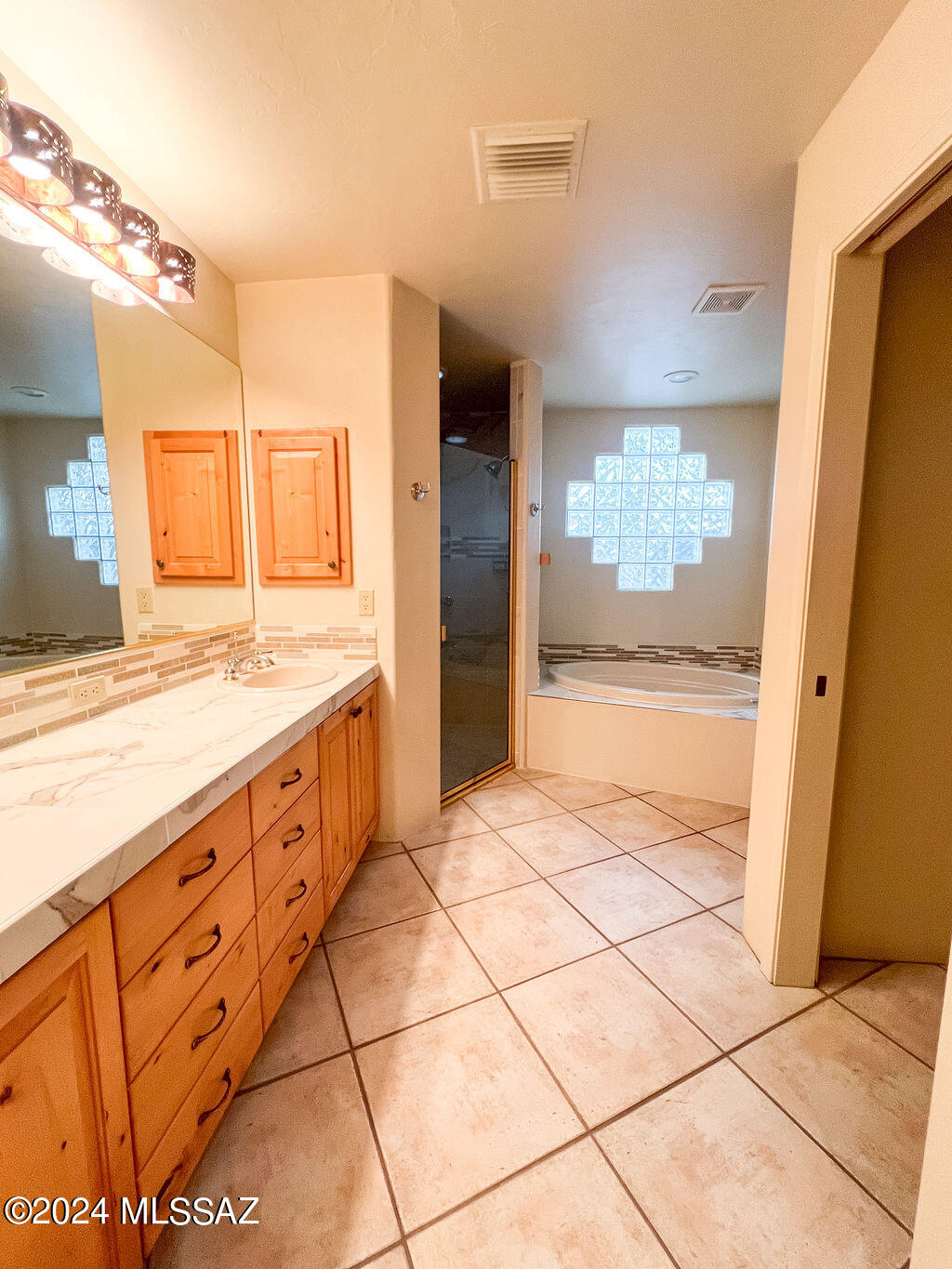 771 West Sedona Ridge Place Oro Valley, AZ 85755 - Photo 18 of 22 a bathroom with a sink a vanity and mirror