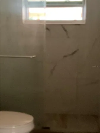 a bathroom with a toilet