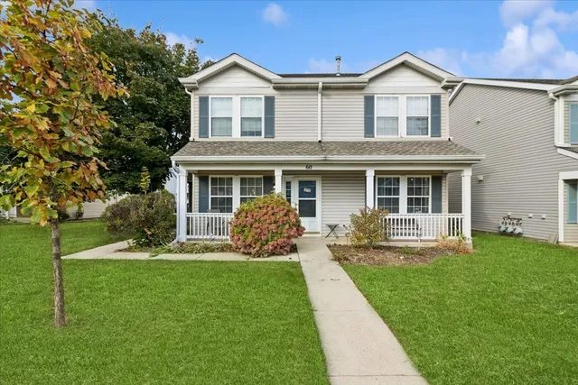 a front view of a house with a yard