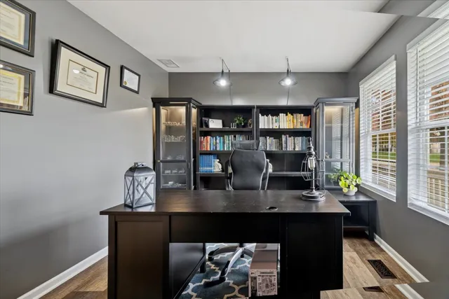 a view of a dining room with furniture and a potted plant