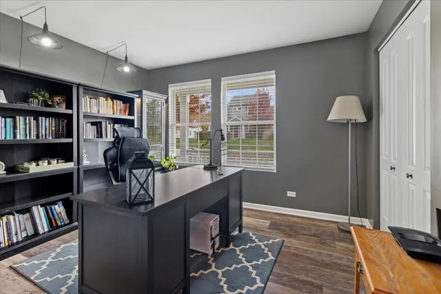 a work room with furniture and book shelf