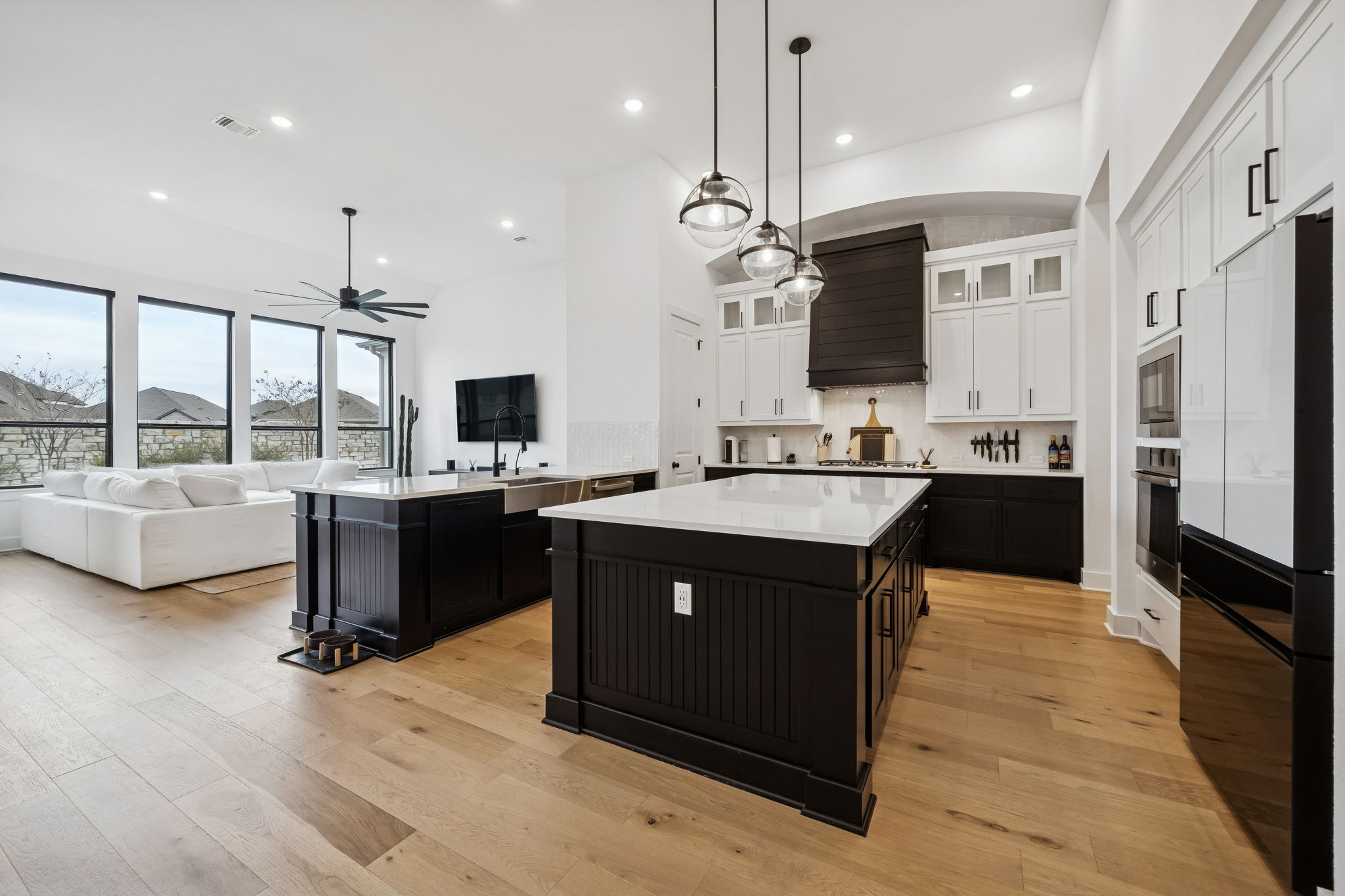 269 Iron Crk Way Kyle, TX 78640 - Photo 31 of 32 a kitchen with a sink stove and refrigerator