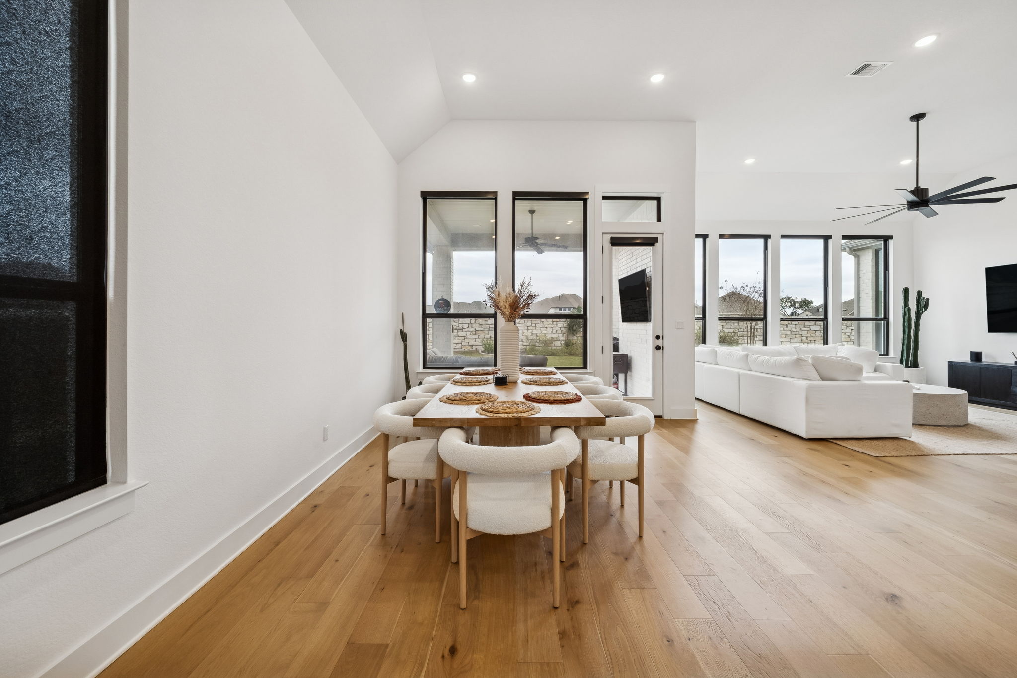 269 Iron Crk Way Kyle, TX 78640 - Photo 13 of 32 a living room with furniture a large window and wooden floor