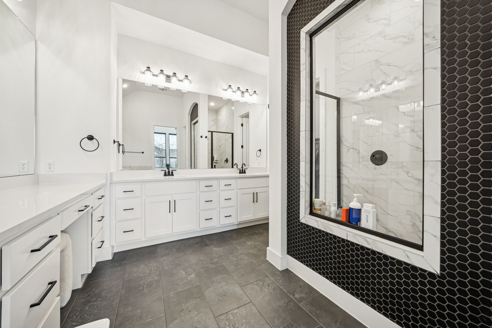 269 Iron Crk Way Kyle, TX 78640 - Photo 17 of 32 a bathroom with a double vanity sink mirror and shower