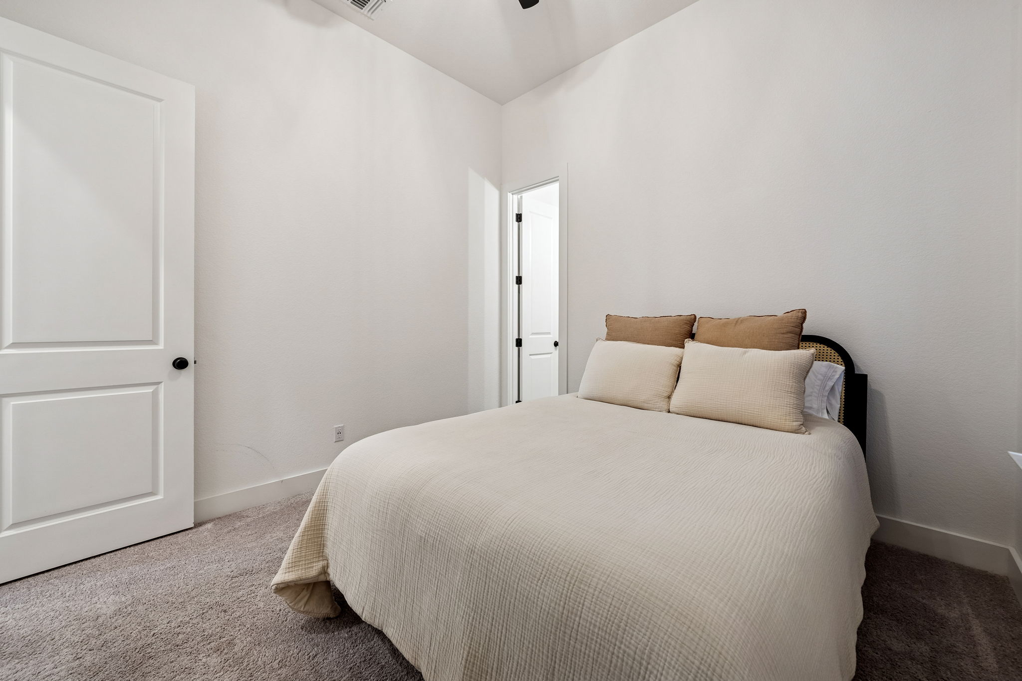 269 Iron Crk Way Kyle, TX 78640 - Photo 20 of 32 a large bed sitting in a bedroom next to a bathroom