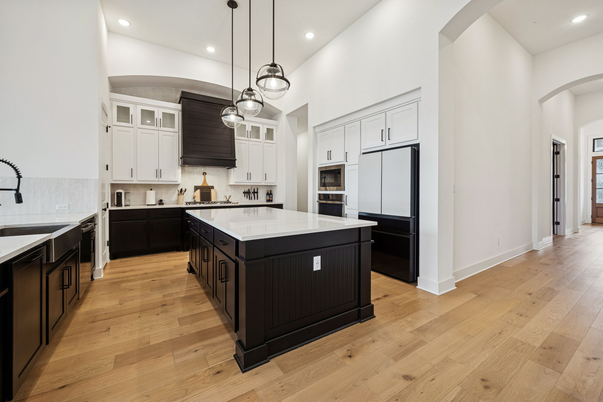 269 Iron Crk Way Kyle, TX 78640 - Photo 6 of 32 a kitchen with a stove a sink a refrigerator and a oven