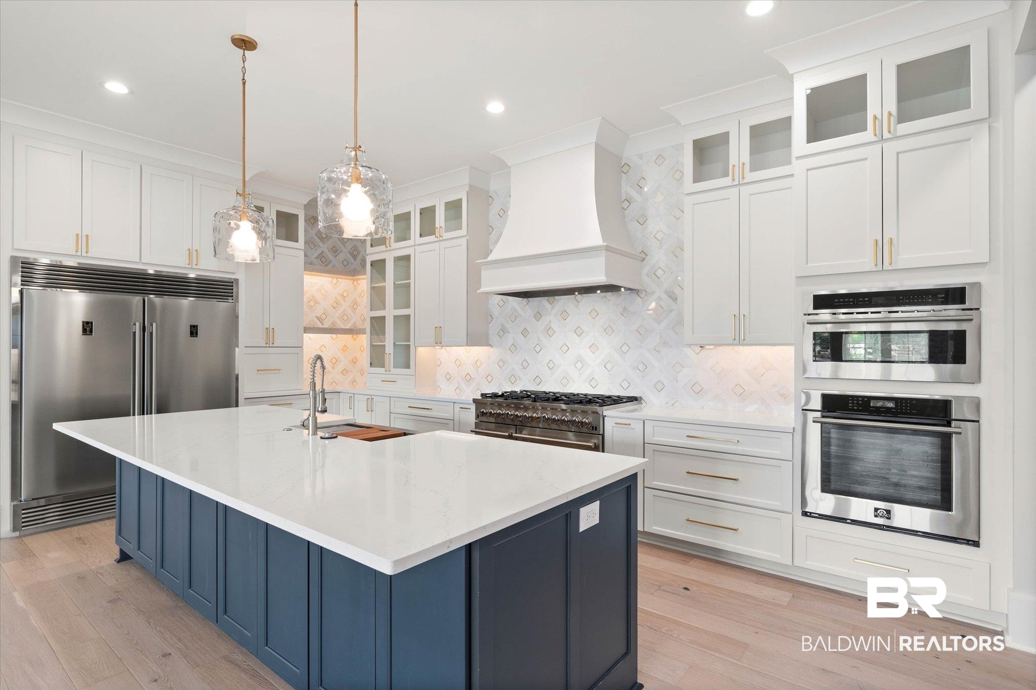 853 Inlet Circle Gulf Shores, AL 36542 - Photo 11 of 55 Kitchen with a sink, backsplash, custom exhaust hood, and high quality appliances