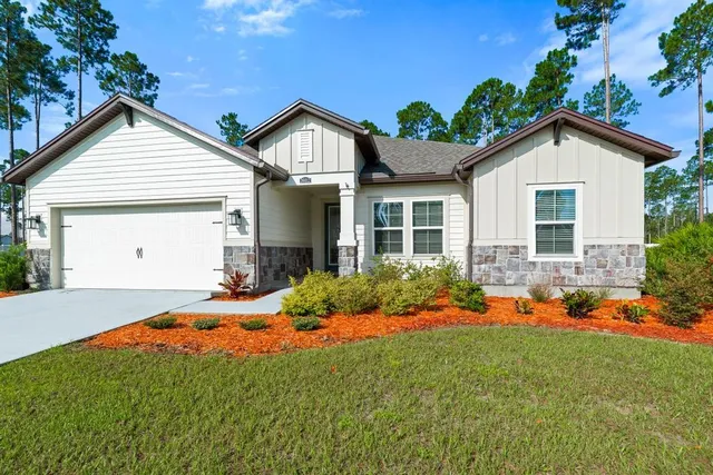a kitchen with stainless steel appliances a refrigerator a sink a stove a microwave and cabinets
