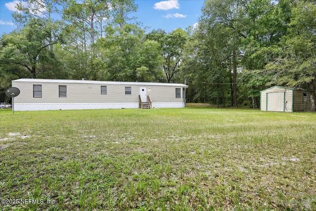 a view of kitchen with wooden floor