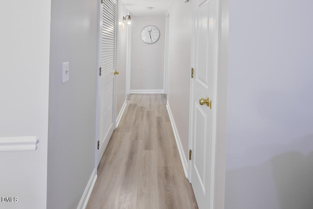 412 Oak Hollow Court Raleigh, NC 27613 - Photo 11 of 24 a view of a hallway with wooden floor and entryway