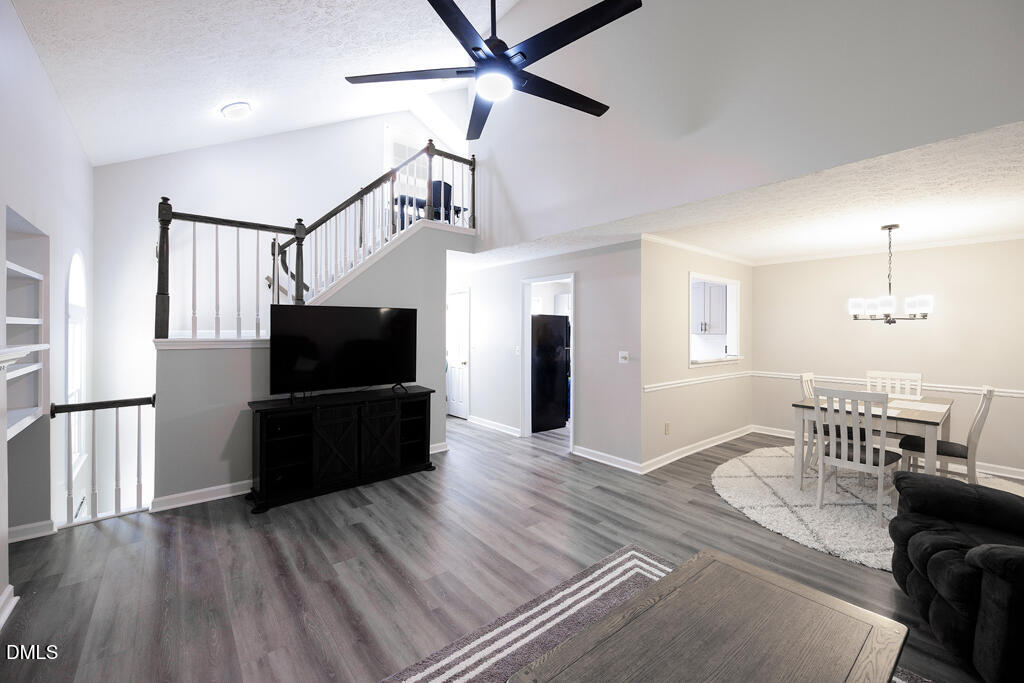 412 Oak Hollow Court Raleigh, NC 27613 - Photo 2 of 24 a living room with furniture and a flat screen tv