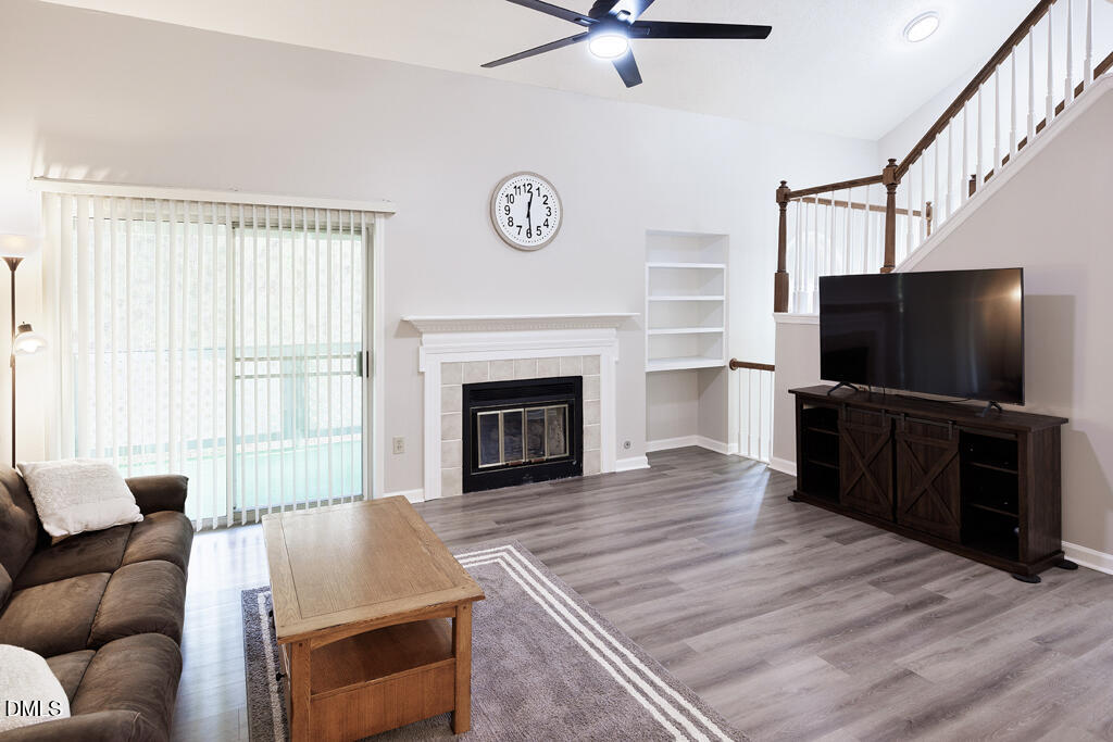 412 Oak Hollow Court Raleigh, NC 27613 - Photo 8 of 24 a living room with furniture and a flat screen tv