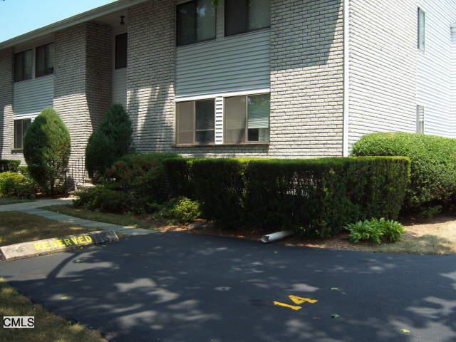 61 Riverside Avenue, Unit B1 Stamford, CT 06905 - Photo 1 of 1 a front view of a house with a yard