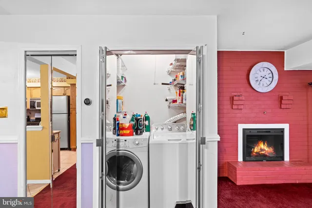 a view of a hallway with washer and dryer