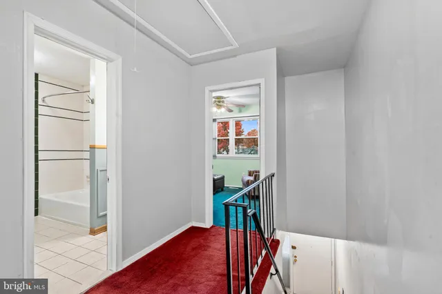 a view of a hallway with a dining room