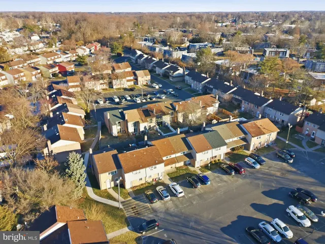 an aerial view of residential houses with outdoor space