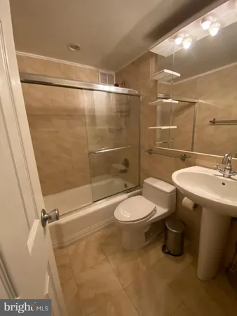 a bathroom with a sink and toilet