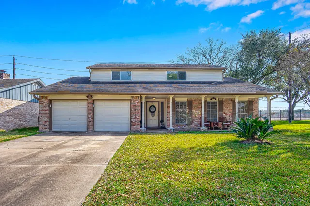 a front view of a house with a yard and porch