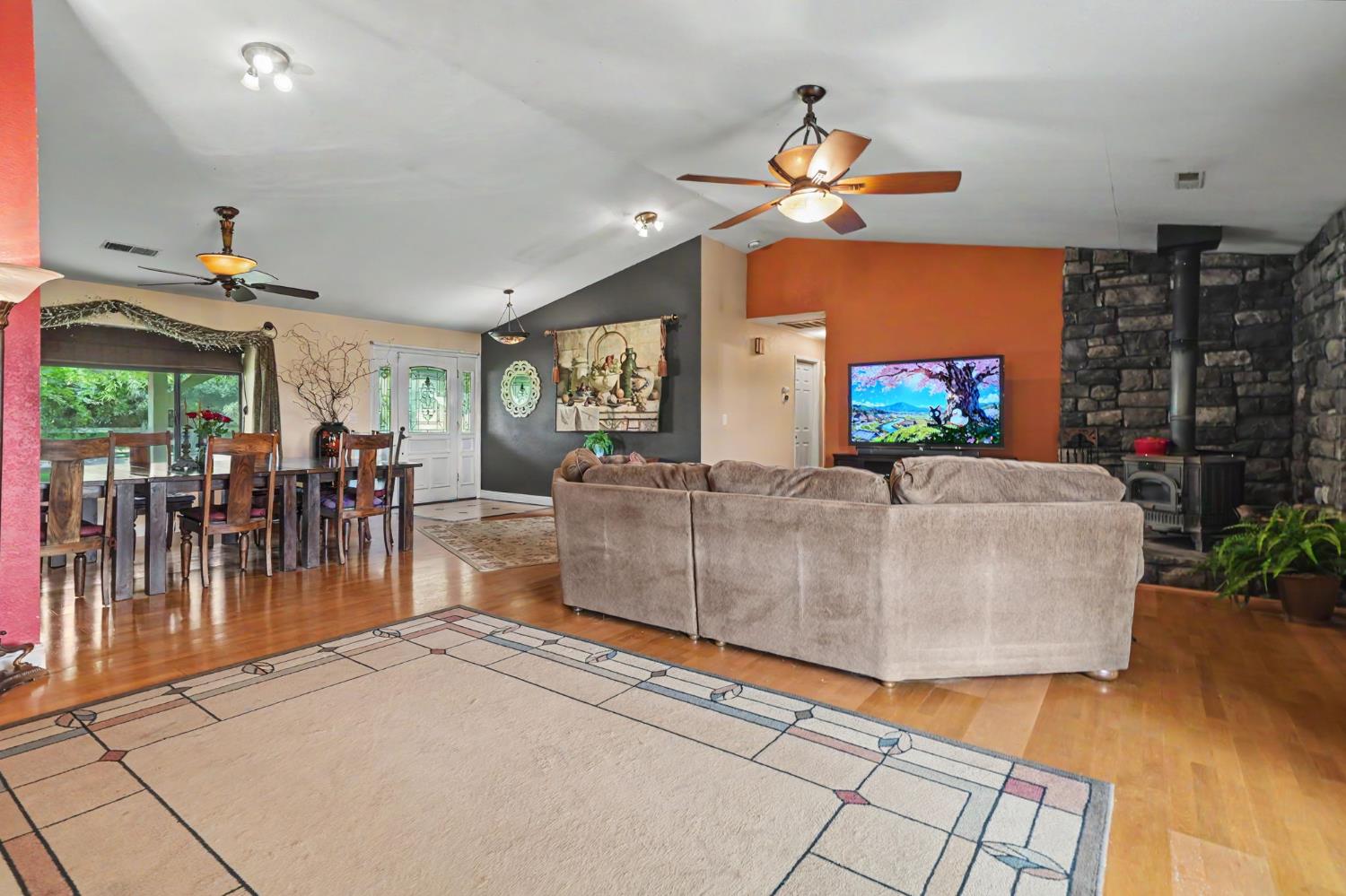 6364 Baldwin Street Valley Springs, CA 95252 - Photo 12 of 72 a living room with furniture and a flat screen tv