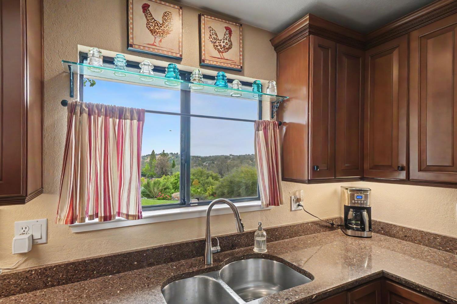 6364 Baldwin Street Valley Springs, CA 95252 - Photo 20 of 72 a kitchen with stainless steel appliances a sink and a window