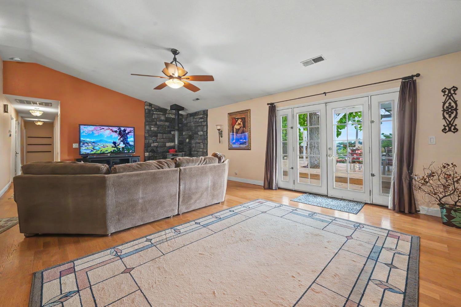 6364 Baldwin Street Valley Springs, CA 95252 - Photo 23 of 72 a living room with furniture and a flat screen tv