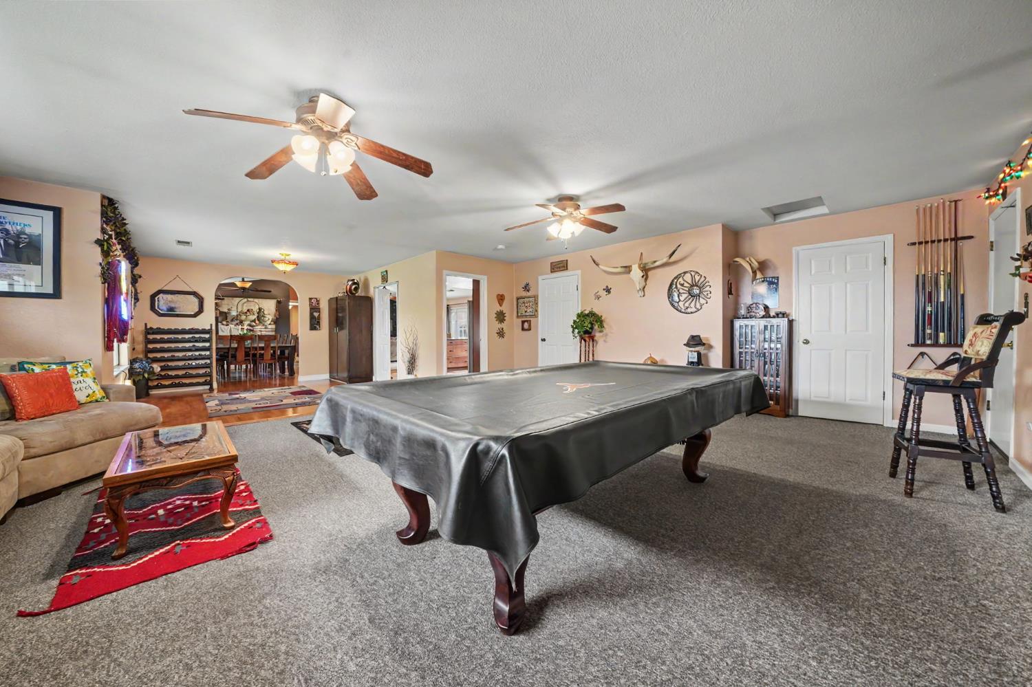 6364 Baldwin Street Valley Springs, CA 95252 - Photo 31 of 72 a living room with furniture pool table and flat screen tv