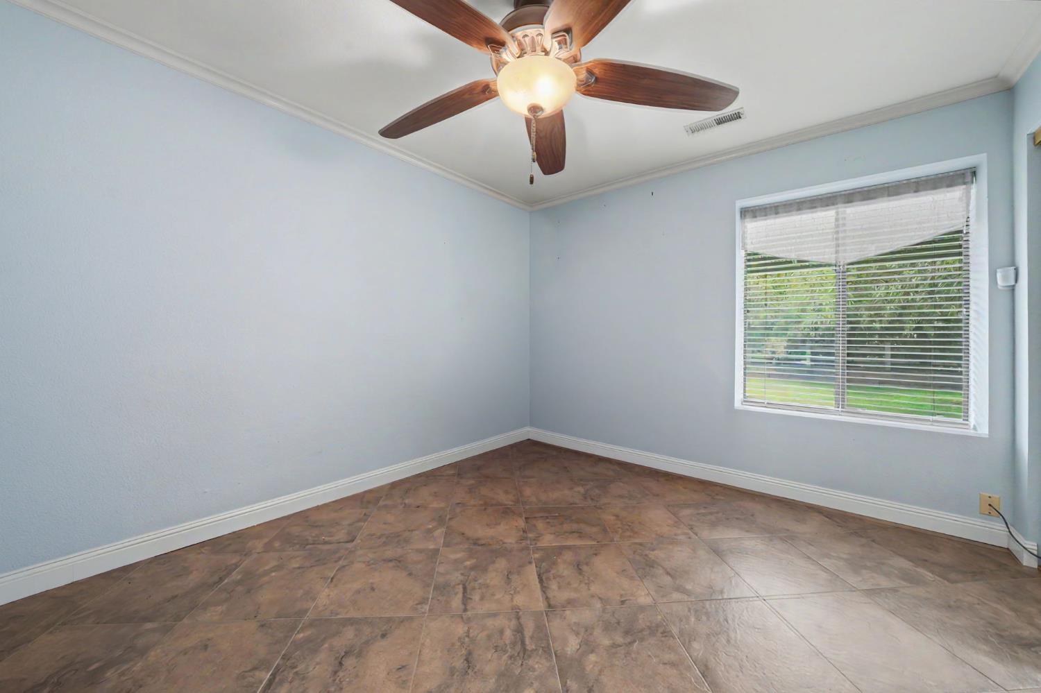 6364 Baldwin Street Valley Springs, CA 95252 - Photo 37 of 72 an empty room with a ceiling fan and window