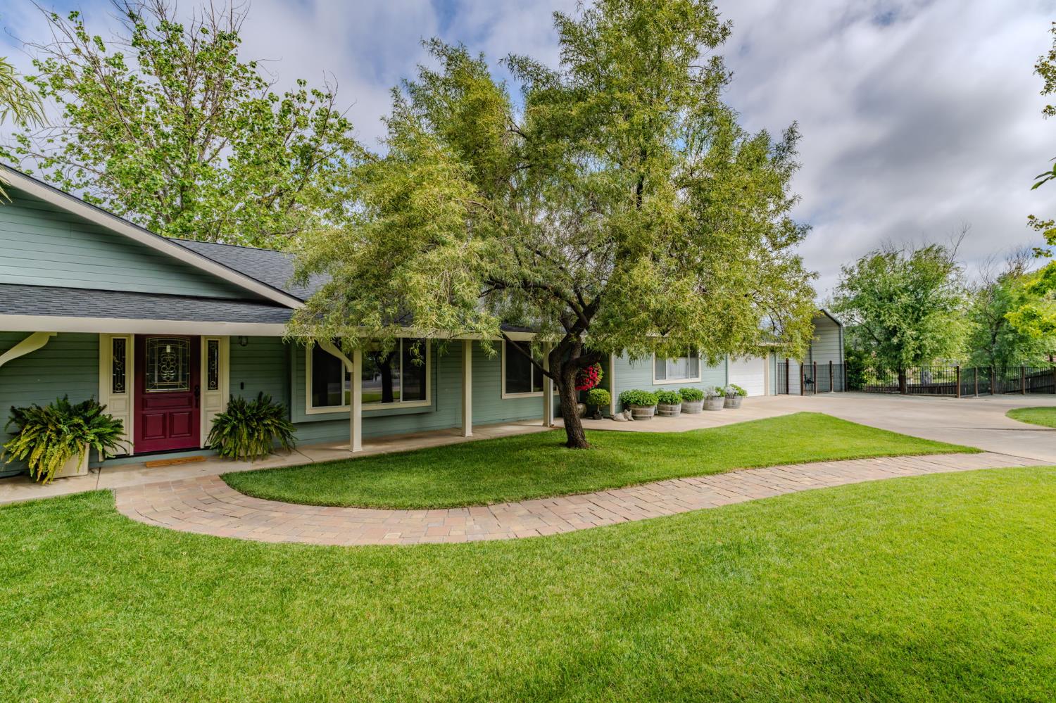 6364 Baldwin Street Valley Springs, CA 95252 - Photo 4 of 72 a view of a house with a yard and tree s