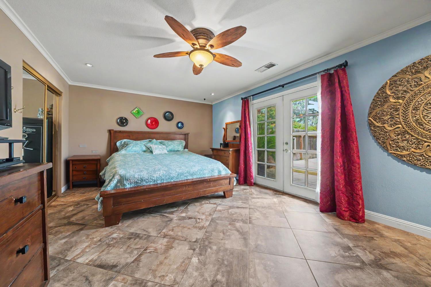 6364 Baldwin Street Valley Springs, CA 95252 - Photo 42 of 72 a bedroom with a bed and a large window
