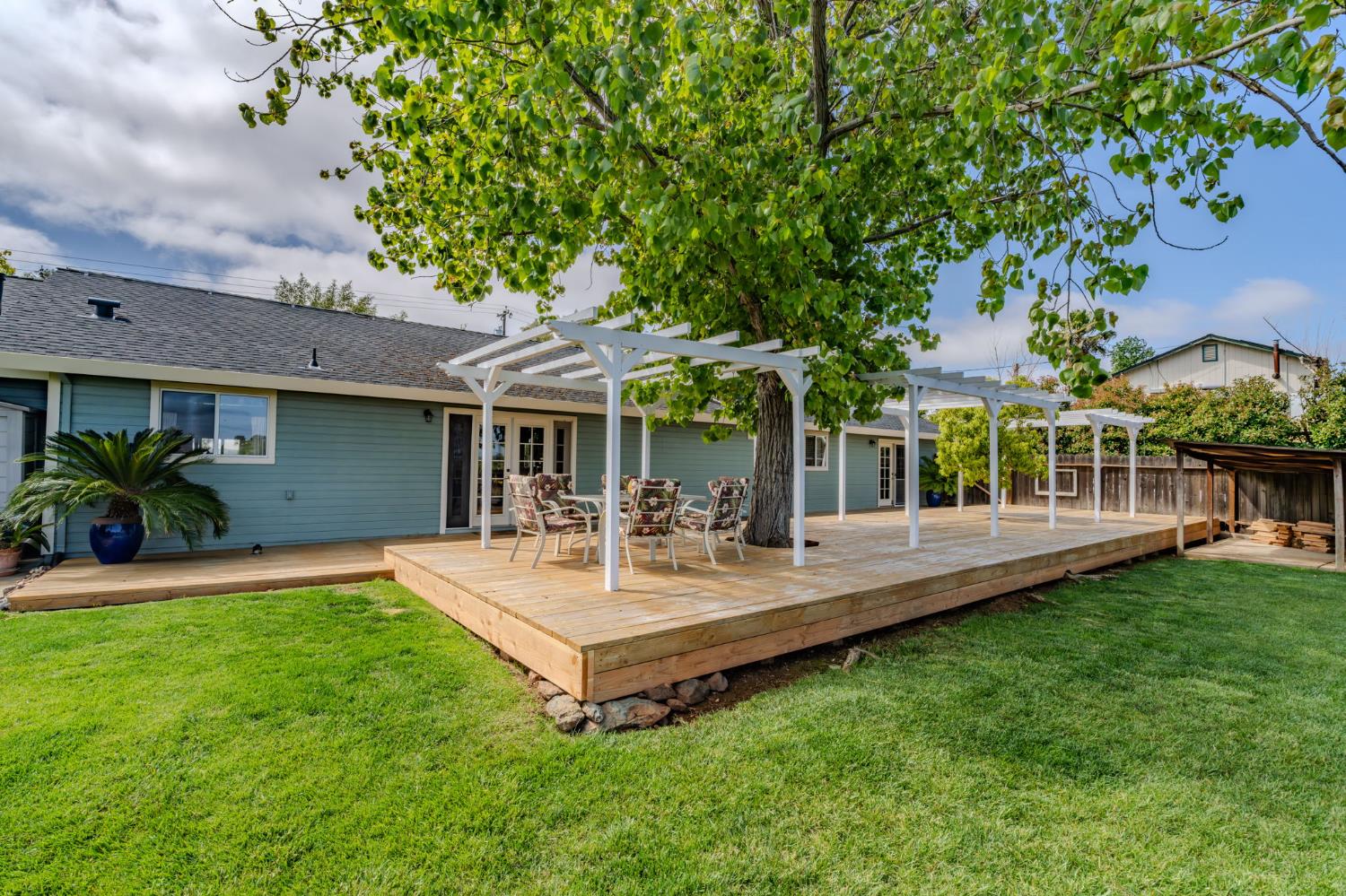 6364 Baldwin Street Valley Springs, CA 95252 - Photo 45 of 72 a view of a house with a backyard and a patio