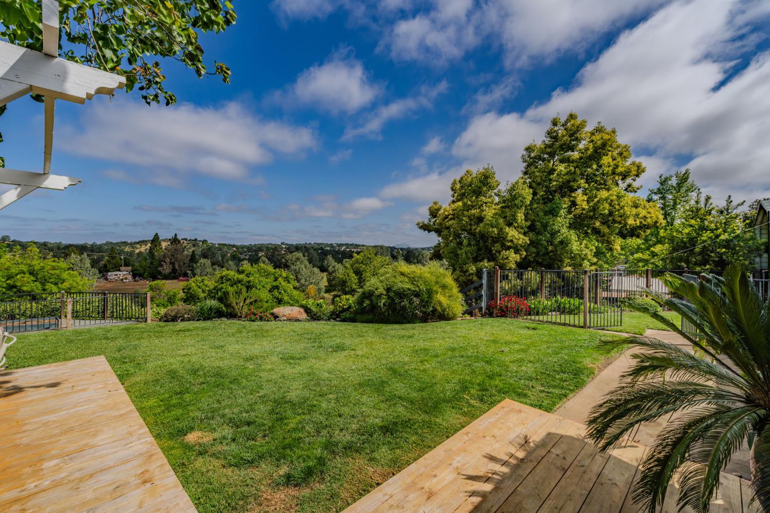 6364 Baldwin Street Valley Springs, CA 95252 - Photo 47 of 72 a view of a garden with a building in the background