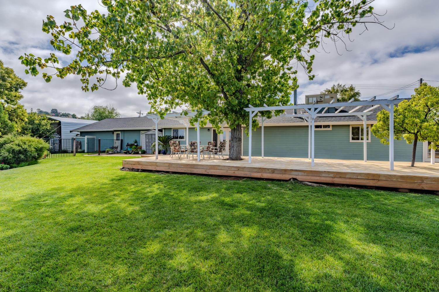 6364 Baldwin Street Valley Springs, CA 95252 - Photo 54 of 72 a view of house with a big yard and large trees