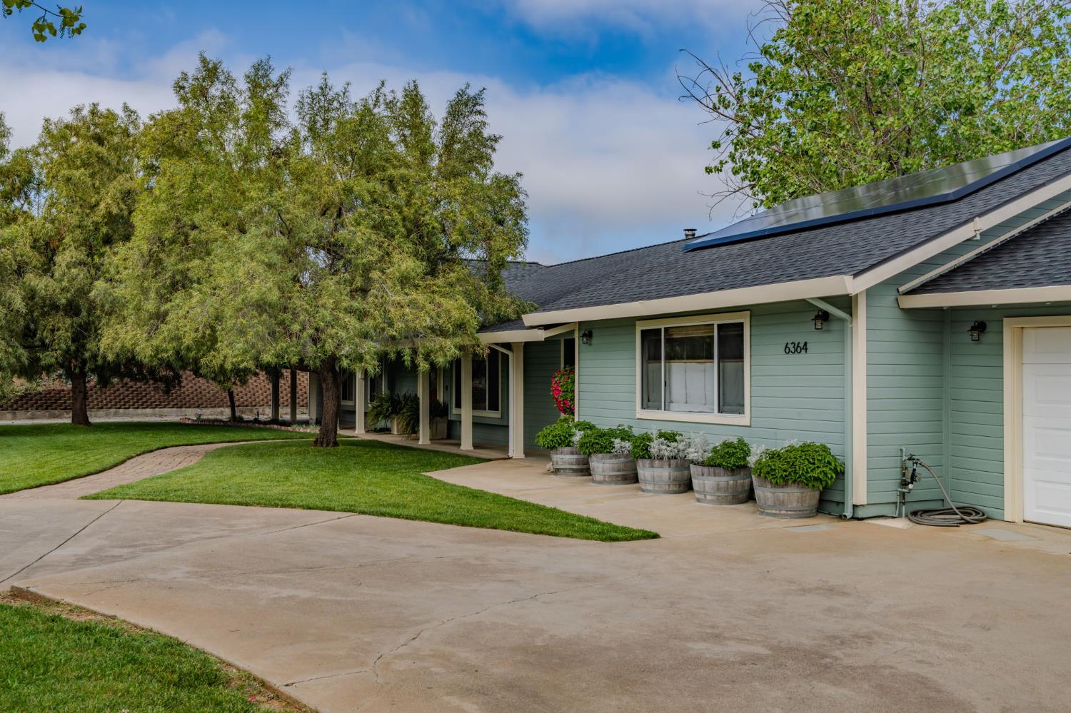 6364 Baldwin Street Valley Springs, CA 95252 - Photo 6 of 72 front view of a house with a yard